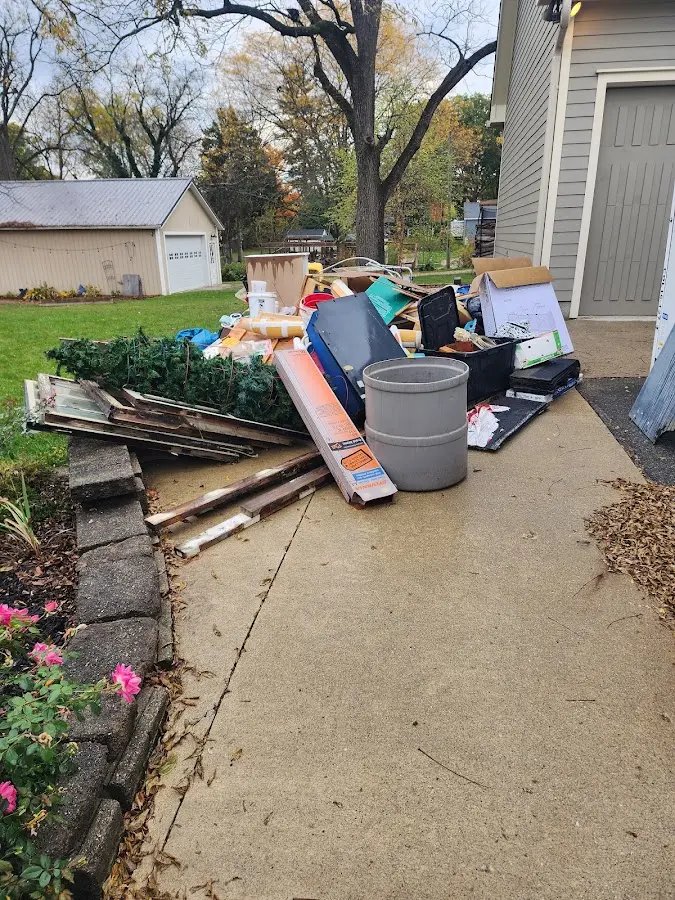 Dumpster being loaded with debris for Residential Dumpster Rental in Wahneta